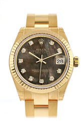 Rolex Datejust 31 Black Mother Of Pearl Diamond Dial Fluted Bezel 18K Yellow Gold Ladies Watch